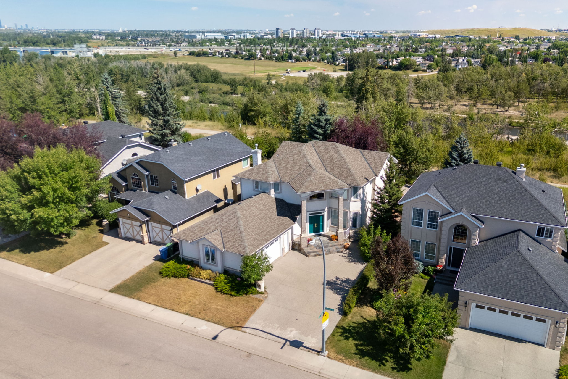Aerial view of 250 Diamond Drive SE backing onto the Bow River valley in Diamond Cove